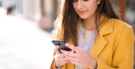 Portrait of a beautiful woman using a mobile