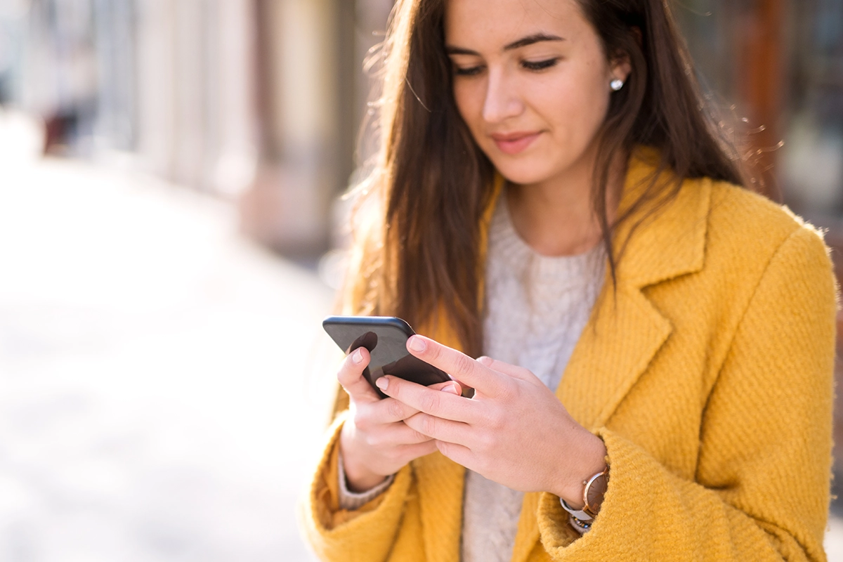 Portrait of a beautiful woman using a mobile