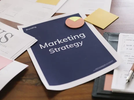 Paper with 'Marketing Strategy' typed on it sitting on a desk