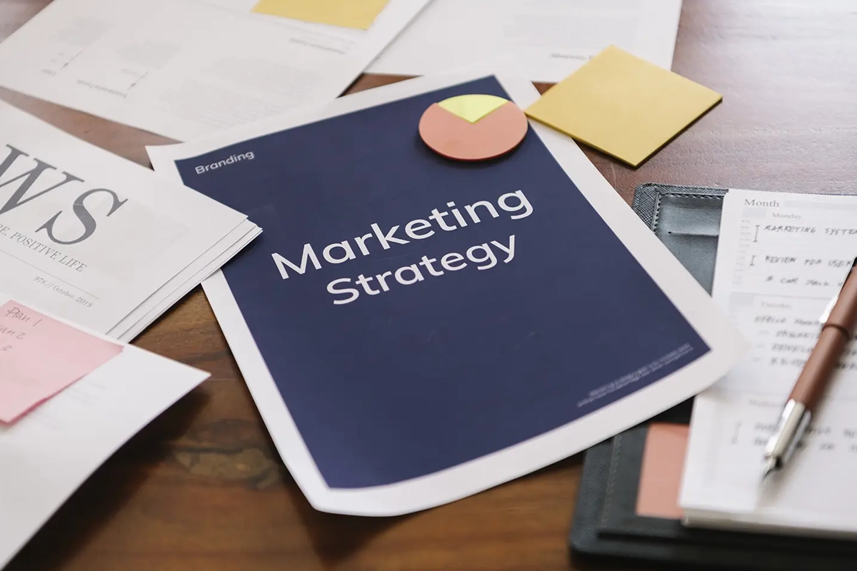 Paper with 'Marketing Strategy' typed on it sitting on a desk