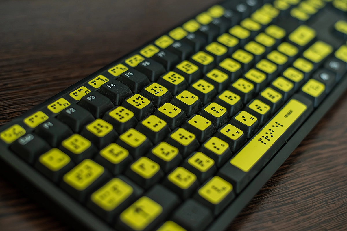 Close up of a keyboard with braille for the blind