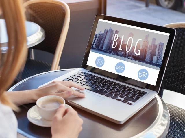 woman reading blog online on computer